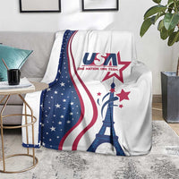 USA Eiffel Tower blanket in white with blue star field and red stripes, draped on gray sofa