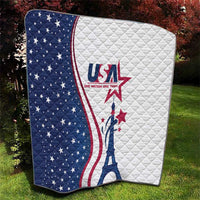 USA-themed quilt laid on grass, blue star panel left and white panel right with Eiffel Tower