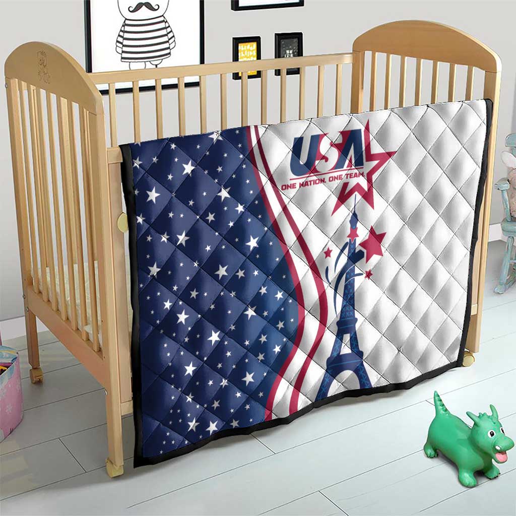 USA-themed quilt on a crib, blue star section left, white section right, Eiffel Tower graphic