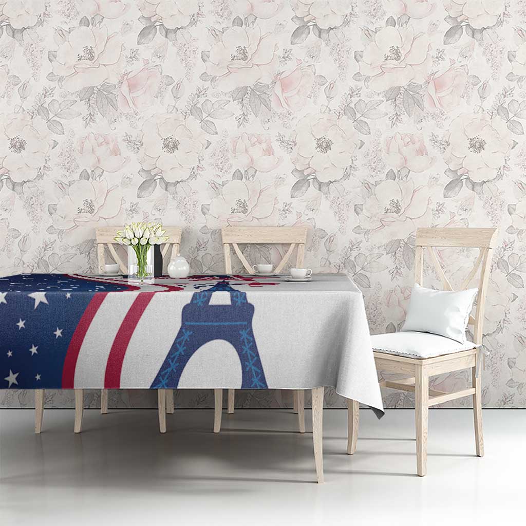 White tablecloth featuring Eiffel Tower and US stars-and-stripes pattern on dining table