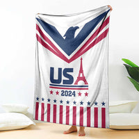 White throw blanket hanging with navy V chevron, red stripes, stars, and Eiffel Tower graphic