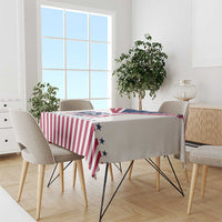 Red-and-white striped tablecloth with blue star accents and Eiffel Tower motif
