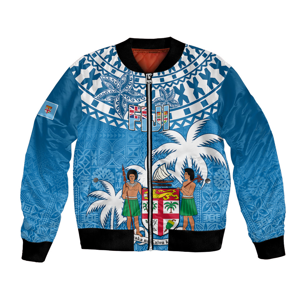 Blue bomber jacket with zip front, black ribbed cuffs, tapa pattern with palm trees