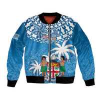 Blue bomber jacket with zip front, black ribbed cuffs, tapa pattern with palm trees