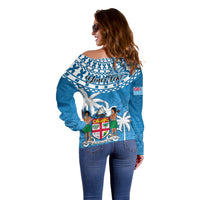 Blue off-shoulder sweater with Fijian tapa graphic and 'Your Text' on back