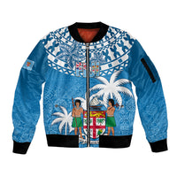 Blue zip-up bomber jacket with white tapa print, palms and island figures, black rib trim.
