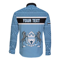 Blue long-sleeve button shirt with dark collar and Your Text Pula graphic panel.