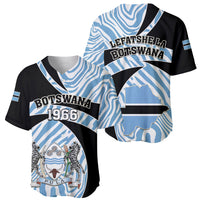 Set of two black and blue baseball jerseys with Botswana 1966 and crest