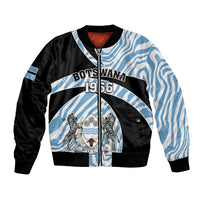 Blue and black bomber jacket with zebra pattern, front zip, ribbed cuffs and hem.