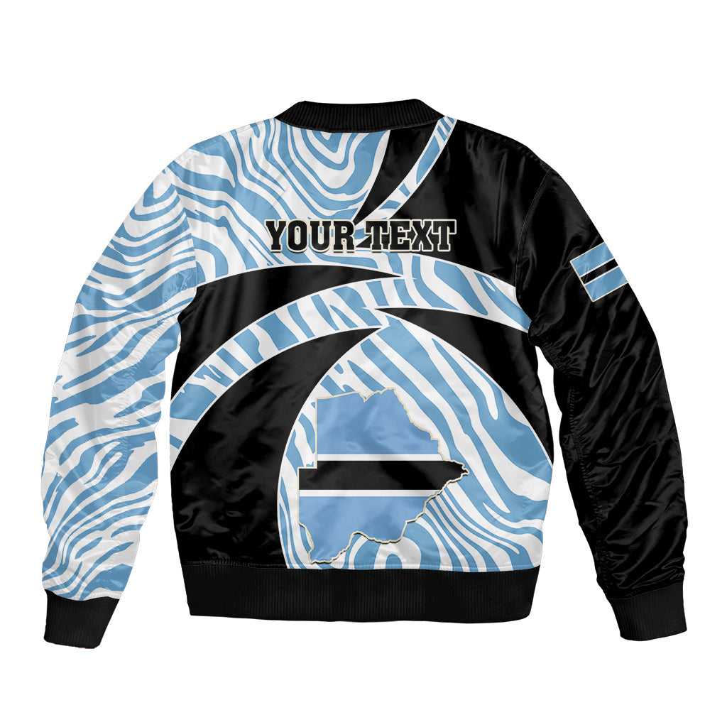 Black and light-blue zebra-pattern bomber jacket with 'YOUR TEXT' graphic and ribbed hem.