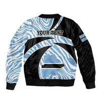 Black and light-blue zebra-pattern bomber jacket with 'YOUR TEXT' graphic and ribbed hem.