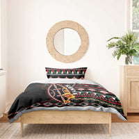 Black duvet with Kenya shield graphic and colorful geometric stripe pattern; matching pillow