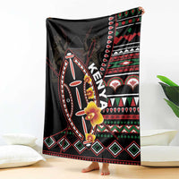 Black Kenya throw blanket with shield motif, floral accents, and red green white geometric border