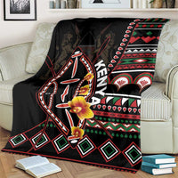Black Kenya blanket with stylized shield and animal figure, red green white motifs, and trim