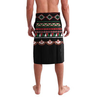 Black board shorts with upper geometric diamonds and striped waist panel