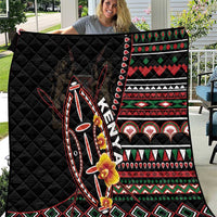 Black quilt laid open, featuring colorful stripe bands, diamonds, and animal shield artwork.