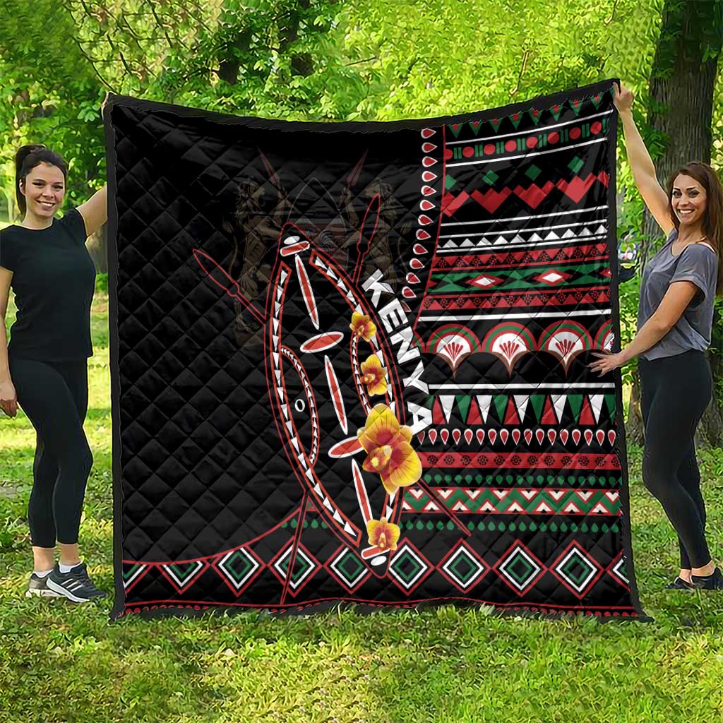 Black quilt with red, green, and white geometric tribal design and floral motifs.