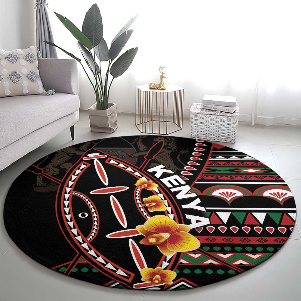 Black round carpet with colorful tribal shield design and yellow-orange flowers