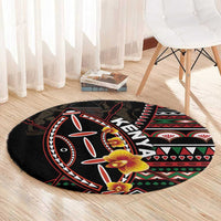 Black round carpet with colorful tribal shield print and yellow-orange blossoms
