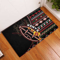 Black rubber doormat with bold Kenya text, tribal patterns, and yellow flowers