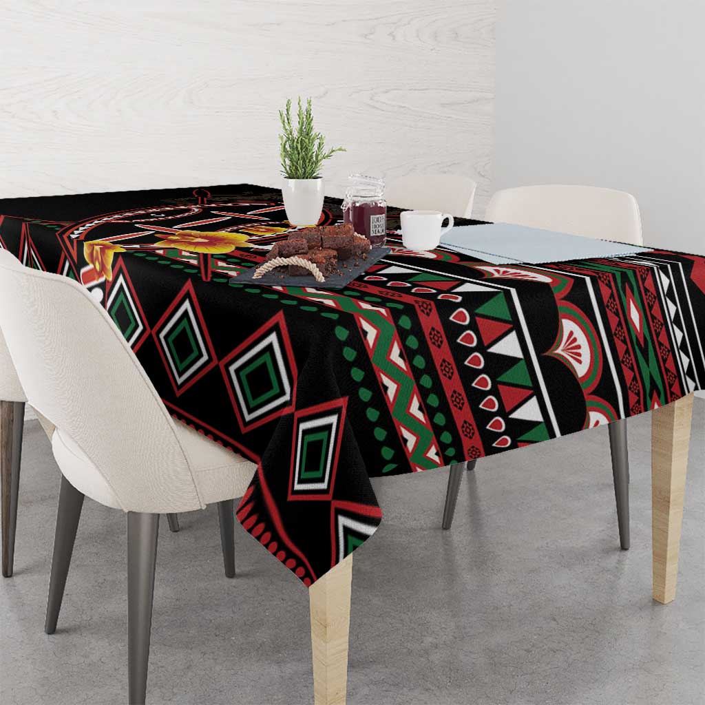 Black tablecloth draped over dining table with geometric diamonds and red border trim