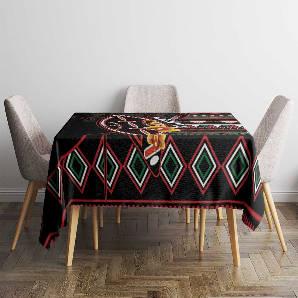 Black tablecloth with bold red border, green diamond shapes, and decorative central motif