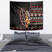 Black tapestry wall hanging with central shield design and red/green geometric trim