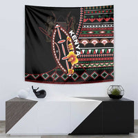 Black tapestry wall hanging with colorful shield artwork and diamond patterned lower border