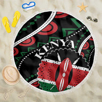 Round beach blanket, black with Kenya-themed African pattern and fringe edging
