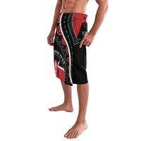 Knee-length wrap-style shorts with black base and red green African print side panel