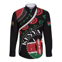 Black long-sleeve button shirt with bold African geometric graphic and flag accents