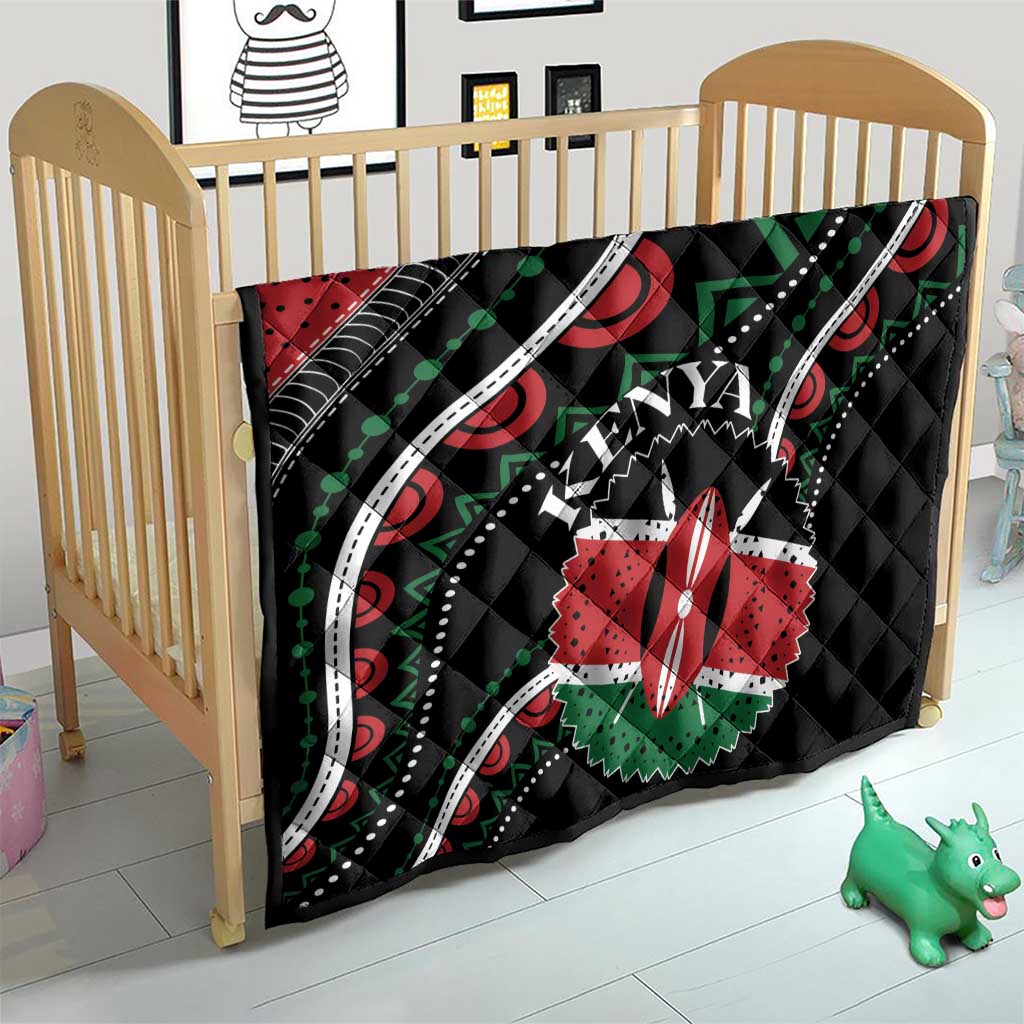 Black Kenya quilt with red star flower, green dots, white curved bands, and stitched texture