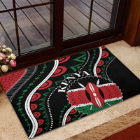 Black rubber doormat with Kenya lettering over red, green, white swirls and borders.