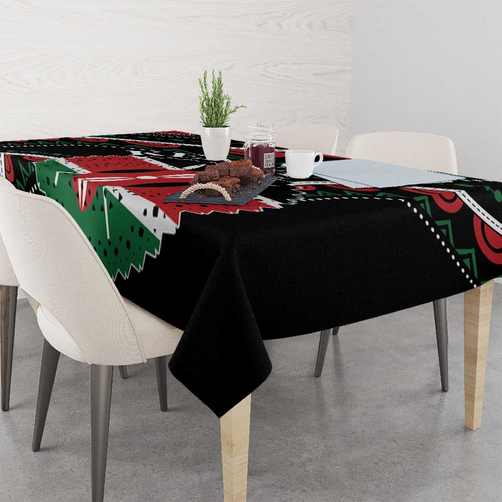 Black tablecloth with green and red patterned design, corners neatly draped