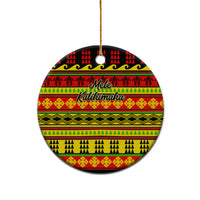 Ceramic circle Christmas ornament with Hawaiian quilt pattern in red, yellow, green, gold loop