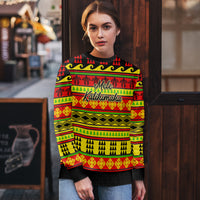 Hawaiian Christmas sweater worn by model, red and green festive stripes with Mele Kalihimaka