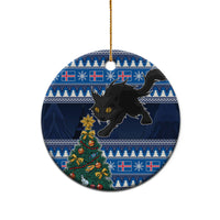 Blue ceramic round Christmas ornament with black cat and decorated tree, gold hanging loop