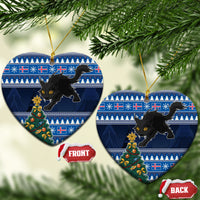 Blue ceramic heart-shaped Christmas ornaments with black cat and decorated tree, gold strings