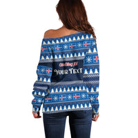Blue off-shoulder sweater back with festive pattern and custom text across the yoke