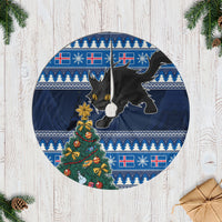 Blue circular Christmas tree skirt with yule cat, Xmas tree, and Nordic pattern