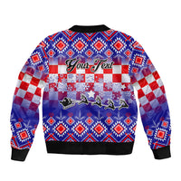 Unisex blue bomber jacket with ribbed collar and hem, festive holiday graphic on back