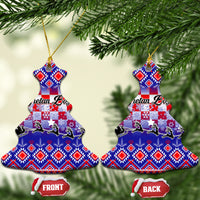 Two blue ceramic Christmas ornaments shaped like trees, Croatian embroidery pattern.