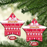 Red star-shaped ceramic Christmas ornament with white eagle, holiday stripe and tree pattern, gold loop