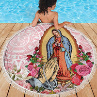 Round beach blanket showing Virgin Guadalupe in blue robe with roses and white trim