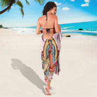 Pink rose-pattern sarong with Virgen de Guadalupe print, draped to mid-calf