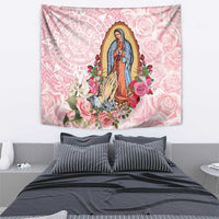 Pink Virgin of Guadalupe tapestry with roses, flowers, and an Aztec-style circular emblem