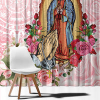 Pink curtain featuring Virgin Guadalupe in blue robe, roses, and decorative bead-like details