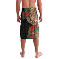 Black lavalava shorts with tan Aztec circle, red flowers, and green leaves