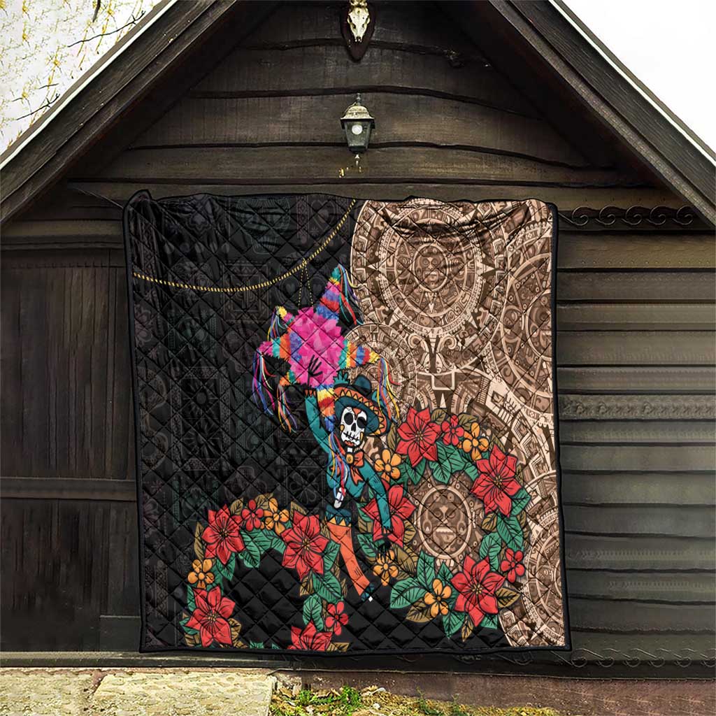 Black quilt blanket hanging on wall with Aztec circle print, skull dancer, and flowers