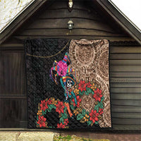 Black quilt blanket hanging on wall with Aztec circle print, skull dancer, and flowers